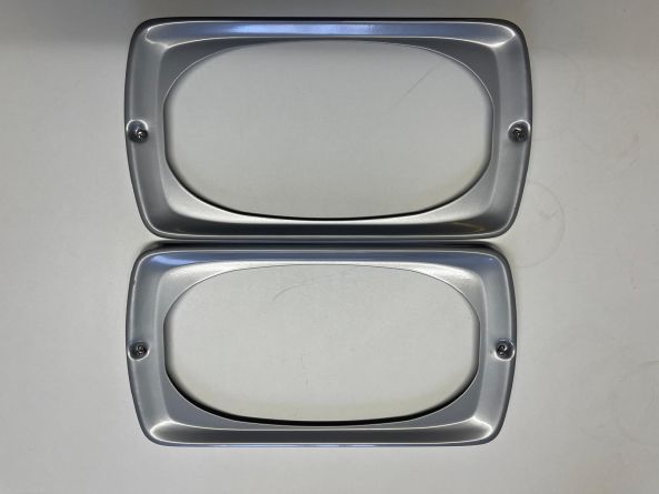 SBU PAIR OF HEADLIGHT SURROUNDS U1000-2450