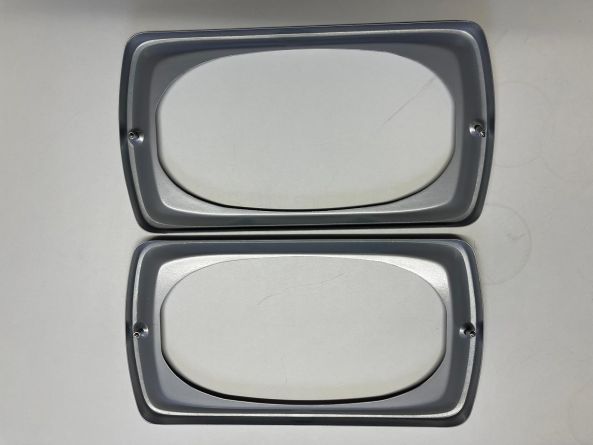 SBU PAIR OF HEADLIGHT SURROUNDS U1000-2450